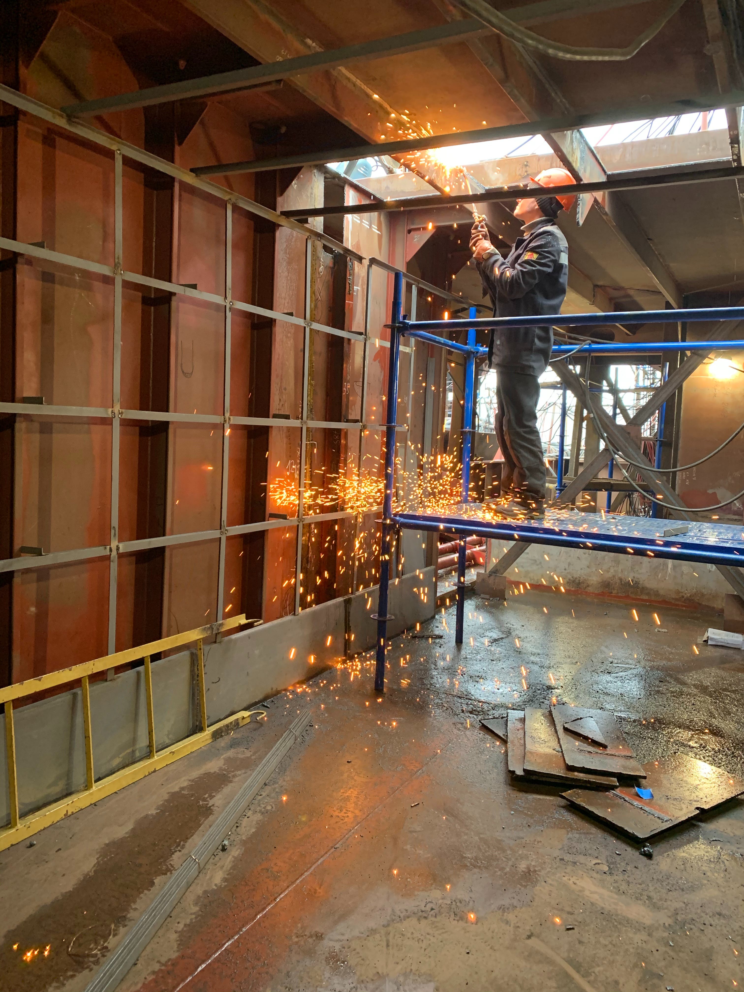 man works on scaffolding